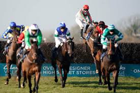 Horses jumping an open ditch